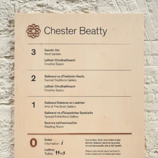 An orientation board in the Chester Beatty Lobby. The sign is made out of high quality ply wood with black screen printed letters and Copper insets for the logo and to mark what floor you are on.