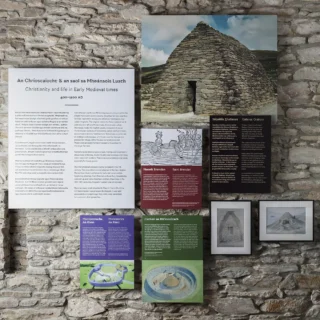 Selection of panels talking about Christianity in West Kerry. There is a large photo of Gallarus Oratory.