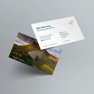Business card for WDC with a photo of Benbulben overlaid with the WDC markup on top.