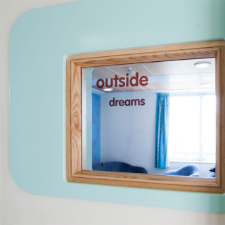 A window with outside written on it