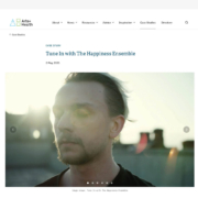 Case study for 'Tune In with The Happiness Ensemble' on Arts+Health website, featuring a close-up of a man with a blurred background