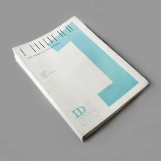 Several brochures stacked together, featuring a large blue 