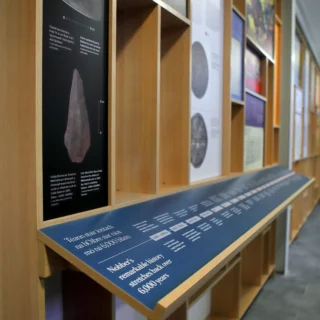 Timber structural detail at an angle showing various panels and a timeline