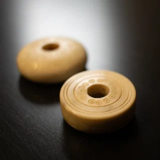 Close-up of a carved spindle whorl artifact