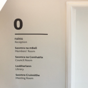 Discreet vinyl lettering signage for staff areas on the ground floor of Academy House