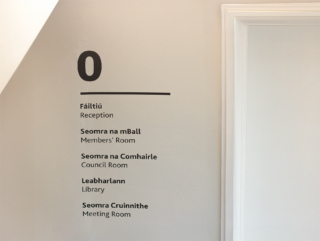 Discreet vinyl lettering signage for staff areas on the ground floor of Academy House
