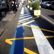 Road painted with stripes of colour