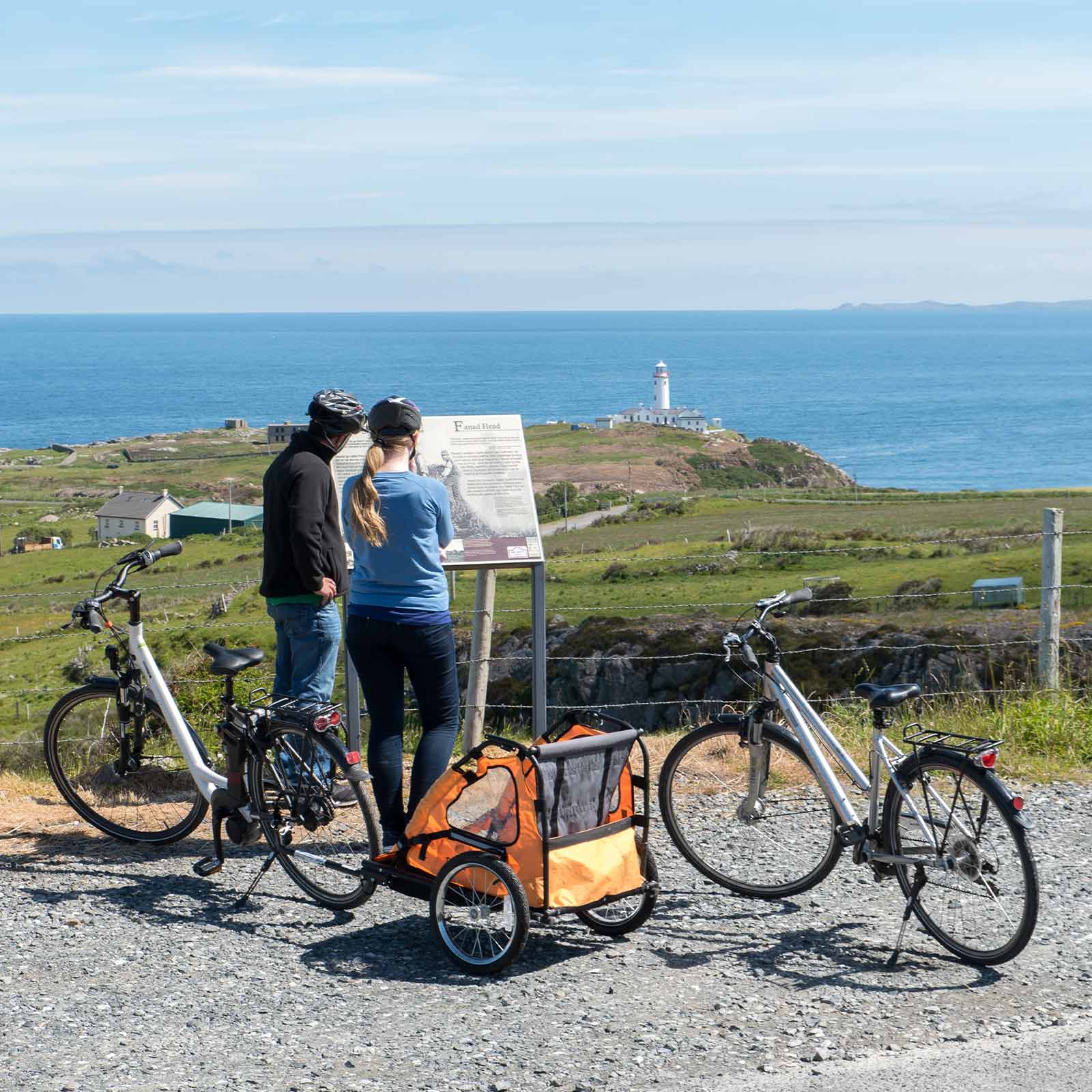 Image of a couple cycling near Fanad Lighthouse